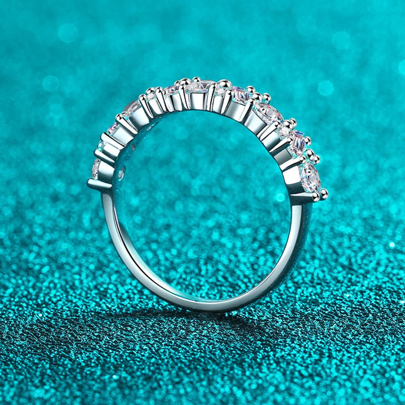 0.9 Carat Total Emerald and Round Cut Moissanite Rhodium Plated 925 Sterling Silver Band