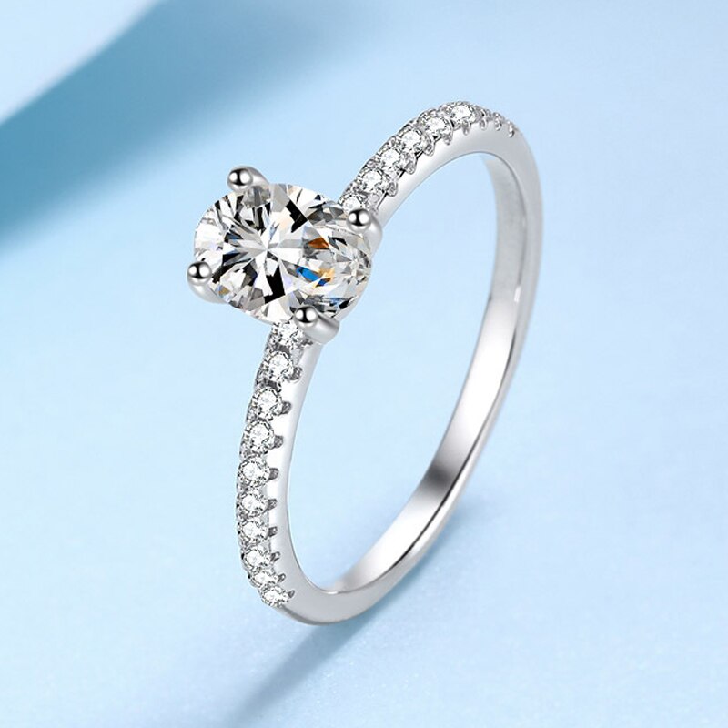 1 Carat or 2 Carat D Color VVS1 Oval Moissanite and Zircon Accent Rhodium Plated 925 Sterling Silver Engagement Ring