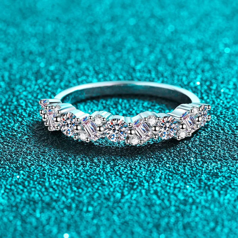 0.9 Carat Total Emerald and Round Cut Moissanite Rhodium Plated 925 Sterling Silver Band