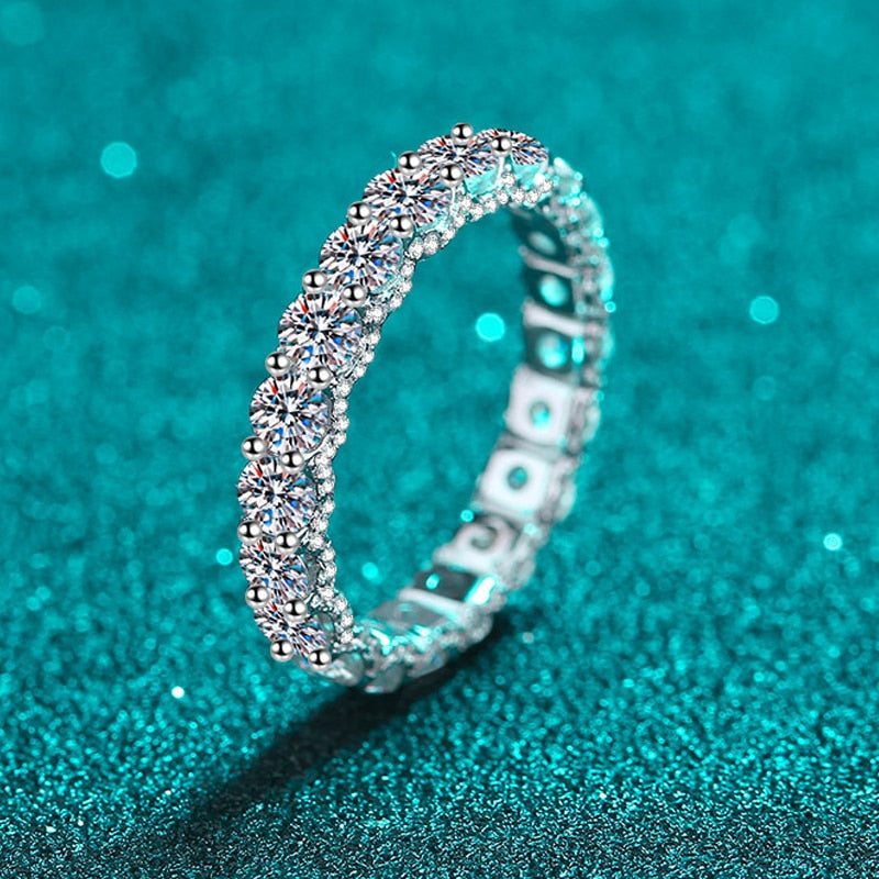 2.1 Carat Total Moissanite and Zircon Accent 18K White Gold Plated 925 Sterling Silver Eternity Band